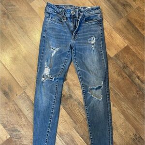 Dark Blue American Eagle Ripped Skinny Jeans.